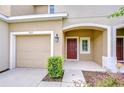 Well-maintained townhome with a private garage and welcoming front entrance at 7077 Woodchase Glen Dr, Riverview, FL 33578