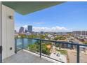 Balcony view overlooking a serene lake and the vibrant cityscape at 777 3Rd N Ave # 1406, St Petersburg, FL 33701
