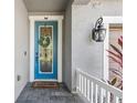 Charming front door with decorative wreath, sidelight, and modern hardware at 12121 Rustic River Way, Tampa, FL 33635