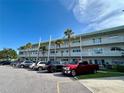 Apartment building exterior showcasing multiple parking spaces and a well-maintained facade at 2070 World Parkway Blvd # 36, Clearwater, FL 33763