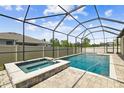 Relaxing screened-in pool and spa area, perfect for outdoor enjoyment at 21837 Briske Morning Ave, Land O Lakes, FL 34637