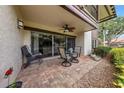 Relaxing outdoor patio with a ceiling fan, and a table and chairs for al fresco dining at 3035 Countryside Blvd # 16B, Clearwater, FL 33761