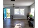 Inviting living room featuring luxury vinyl plank flooring and lots of natural light at 4470 Mainlands W Blvd, Pinellas Park, FL 33782