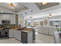 Well-appointed kitchen with modern appliances and a breakfast bar, seamlessly flowing into the living area at 449 S 12Th St # 1004, Tampa, FL 33602