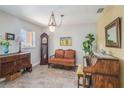 Cozy living room featuring natural light, tiled floor, and traditional furnishings at 7802 134Th St, Seminole, FL 33776