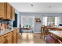 Bright kitchen featuring wood cabinets, tile floors, stainless appliances and an eat in area at 10457 Cranston St, Spring Hill, FL 34608