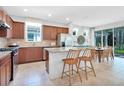 Well-equipped kitchen with granite countertops, stainless steel appliances, and an adjacent dining area for casual meals at 11444 Shoreline Trl, Parrish, FL 34219