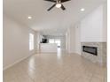 Spacious living area with tile floors, recessed lighting, and modern fireplace at 11448 Bay Gardens Loop, Riverview, FL 33569