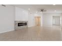 Spacious living room featuring neutral paint and a modern fireplace at 11448 Bay Gardens Loop, Riverview, FL 33569