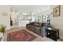 Inviting living room with plush sofa, neutral walls, and an open layout leading to the kitchen at 1201 High Hammock Dr # 302, Tampa, FL 33619
