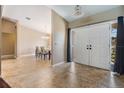 Welcoming foyer with tile flooring leading into the dining room, creating an open and airy feel at 13167 Roseanna Dr, Spring Hill, FL 34609