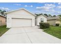 Well-maintained single-story home showcasing a two-car garage and neatly kept lawn at 518 Winthrop Dr, Spring Hill, FL 34609
