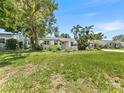 Lovely single-story home with beautiful landscaping, mature trees, and inviting curb appeal at 5514 7Th N Ave, St Petersburg, FL 33710