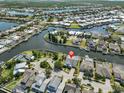 Stunning aerial perspective of a waterfront community with lush landscaping and serene canals at 5710 Tortoise Pl, Apollo Beach, FL 33572