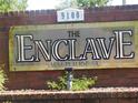 Community sign reads The Enclave At St. Petersburg at 9100 Dr Martin Luther King Jr N St # 303, St Petersburg, FL 33702