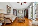 Elegant living room boasts hardwood floors, natural light and tasteful decor at 9220 Hidden Water Cir, Riverview, FL 33578