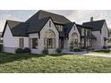 Stunning home showcases stone and siding accents and a well-maintained lawn at 125 Avonwood, Tampa, FL 33625