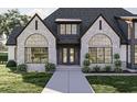 Charming home features stone accents, arched windows, and a welcoming front entrance at 125 Avonwood, Tampa, FL 33625