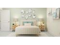 A beautifully staged bedroom featuring a stylish bed, matching nightstands, and a neutral color scheme at 1554 Serenity Outlook Ct, Lutz, FL 33548