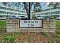 A brick sign reads 'Dorado 2256' in front of the building, surrounded by lush grass at 2256 Philippine Dr # 24, Clearwater, FL 33763