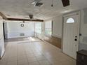 Spacious living room with tile floors and natural light from the windows at 2619 Albion St, Holiday, FL 34691