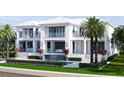 Beautiful waterfront home with a pool, waterfall, covered balconies, and lush landscaping at 38 Ladoga Ave, Tampa, FL 33606