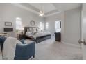 Spacious main bedroom featuring a tray ceiling, sitting area, and plenty of natural light at 403 S Fremont Ave # 3, Tampa, FL 33606