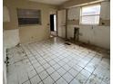 Picture of kitchen interior showing tile flooring and natural light from window at 4050 Iris N St, St Petersburg, FL 33703