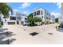 Exterior view of townhomes featuring ample parking and modern architectural details at 4515 W North A St # 6, Tampa, FL 33609