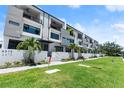 Street view of modern townhouses with well-maintained landscaping and sidewalks at 4515 W North A St # 6, Tampa, FL 33609