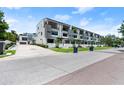 Exterior view of modern townhomes with ample parking and landscaped grounds at 4515 W North A St # 6, Tampa, FL 33609