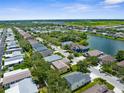 Overview of a neighborhood situated around a serene lake at 5015 58Th E Ter, Bradenton, FL 34203