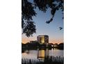 High-rise building with the lake reflecting lights at dusk providing a serene ambiance at 777 3Rd N Ave # 1503, St Petersburg, FL 33701