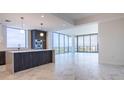 Modern kitchen with a center island and floor to ceiling windows at 777 3Rd N Ave # 1603, St Petersburg, FL 33701