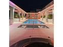 Night view of pool and spa with illuminated architectural details and fire feature at 777 3Rd N Ave # 1703, St Petersburg, FL 33701