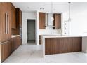 Modern kitchen with sleek cabinets, center island, and stainless steel appliances at 777 3Rd N Ave # 1704, St Petersburg, FL 33701