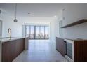 Bright, open living room with sleek finishes and city views at 777 3Rd N Ave # 1704, St Petersburg, FL 33701