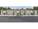 Charming townhomes featuring Craftsman architecture, attached garages, and beautifully landscaped common areas at 961 Spotted Egret Loop, Ruskin, FL 33570