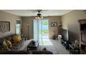 Cozy living room with a sliding glass door and a relaxing atmosphere at 12231 Fairlawn Dr, Riverview, FL 33579