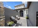 Cozy front porch with stylish patio furniture and decorative plants, offering a welcoming outdoor living space at 288 Villa Corte Dr, Lutz, FL 33549
