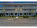 Inviting building with well-maintained lawn and blue doors, offering a welcoming curb appeal at 4895 Bay Ne St # 207, St Petersburg, FL 33703