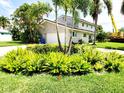 Front exterior showcasing well-maintained lawn and landscape at 5101 Dover Ne St, St Petersburg, FL 33703
