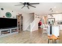 Open-concept living space with stairs, fan, and modern decor at 5519 Tripoli Dr, Palmetto, FL 34221