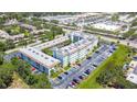 Aerial view of the condo building showing the layout, landscaping and parking areas at 801 83Rd N Ave # 412, St Petersburg, FL 33702