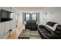Bright living room with hardwood floors, modern furnishings and plenty of natural light at 801 83Rd N Ave # 412, St Petersburg, FL 33702