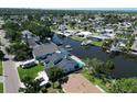 Picture of an established neighborhood's real estate and a canal that empties into a bay at 10729 Drummond Rd, Tampa, FL 33615