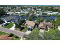 A waterfront property featuring well-maintained lawns, private docks, and access to stunning water views at 10729 Drummond Rd, Tampa, FL 33615