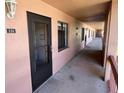 Condo hallway featuring unit number, exterior lighting, and exterior view at 110 Lakeside Ct # 110, Oldsmar, FL 34677