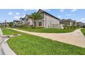 A single-Gathering home on a corner lot, complemented by verdant landscaping at 11002 Sundrift Dr, Tampa, FL 33647