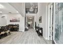 Grand foyer featuring a soaring ceiling, elegant chandelier, and tile floors at 11002 Sundrift Dr, Tampa, FL 33647